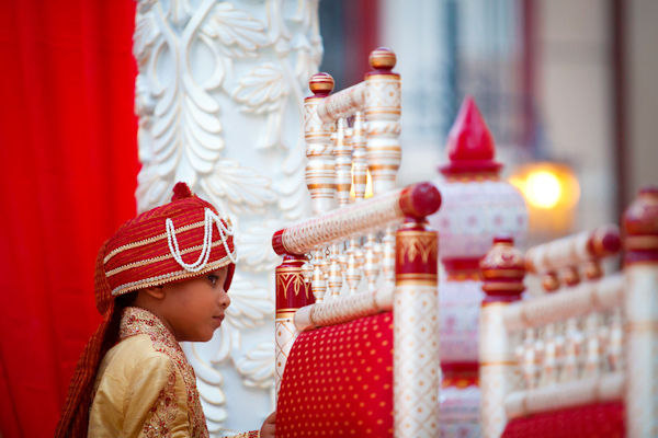 adorable photo of young boy in traditional Indian ceremony - photo by Florida based destination wedding photographer Chip Litherland of Eleven Weddings